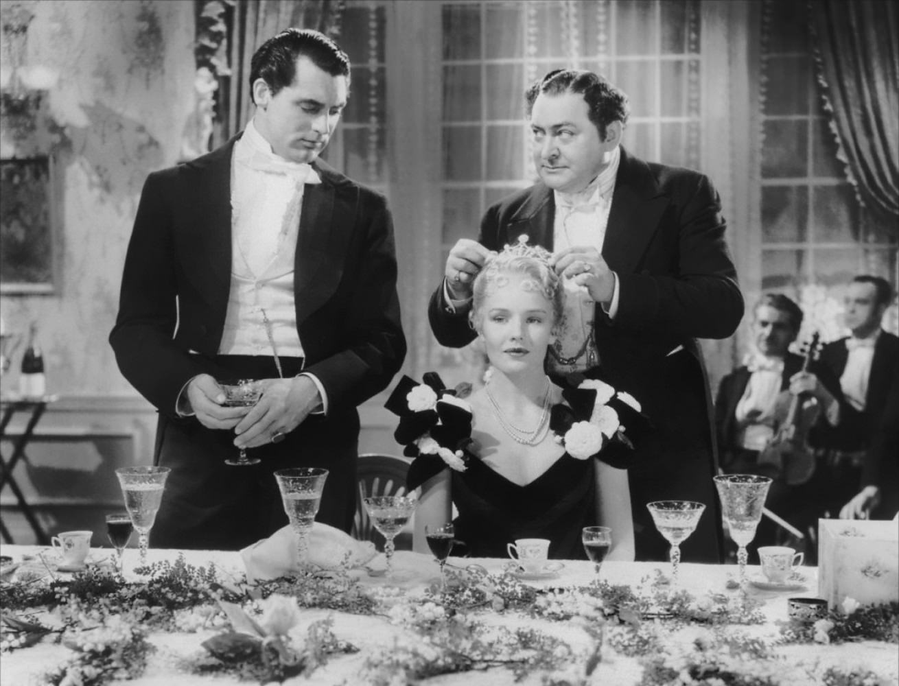 Cary Grant, Frances Farmer and Edward Arnold in The toast of New York , 1937