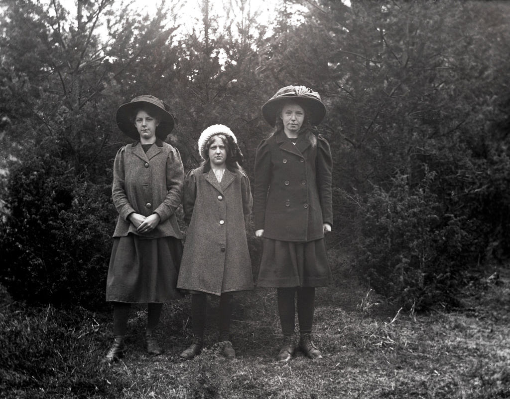 Three girls in the forest.