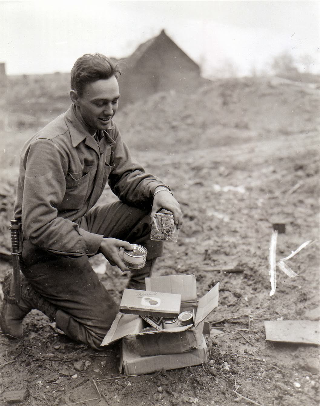 An American soldier with Christmas presents from home.