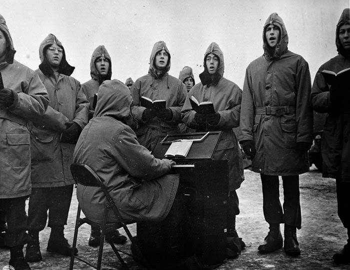 U.S. Soldiers Caroleers Circle Globe.The Christmas spirit is universal, the traditions unchanging even in the midst of war.