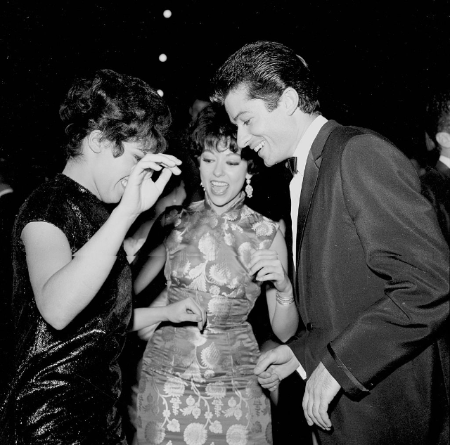 Rita Moreno and George Chakiris attend an event in Los Angeles, circa 1961.