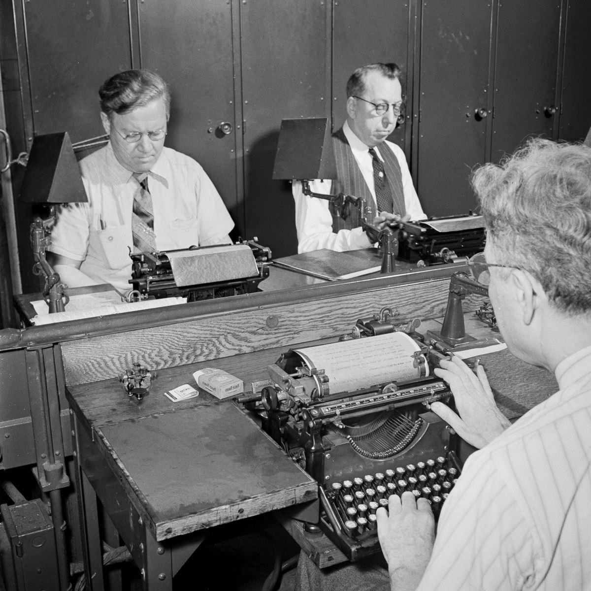 In the wire room, telegraphers record messages received by Western Union and Postal Telegraph from Times correspondents across the United States and abroad.