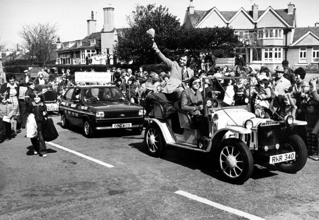 Ken Dodd leads a parade in Hoylake in aid the Clatterbridge Hospital Cancer Research Trust, 6th April 1978.