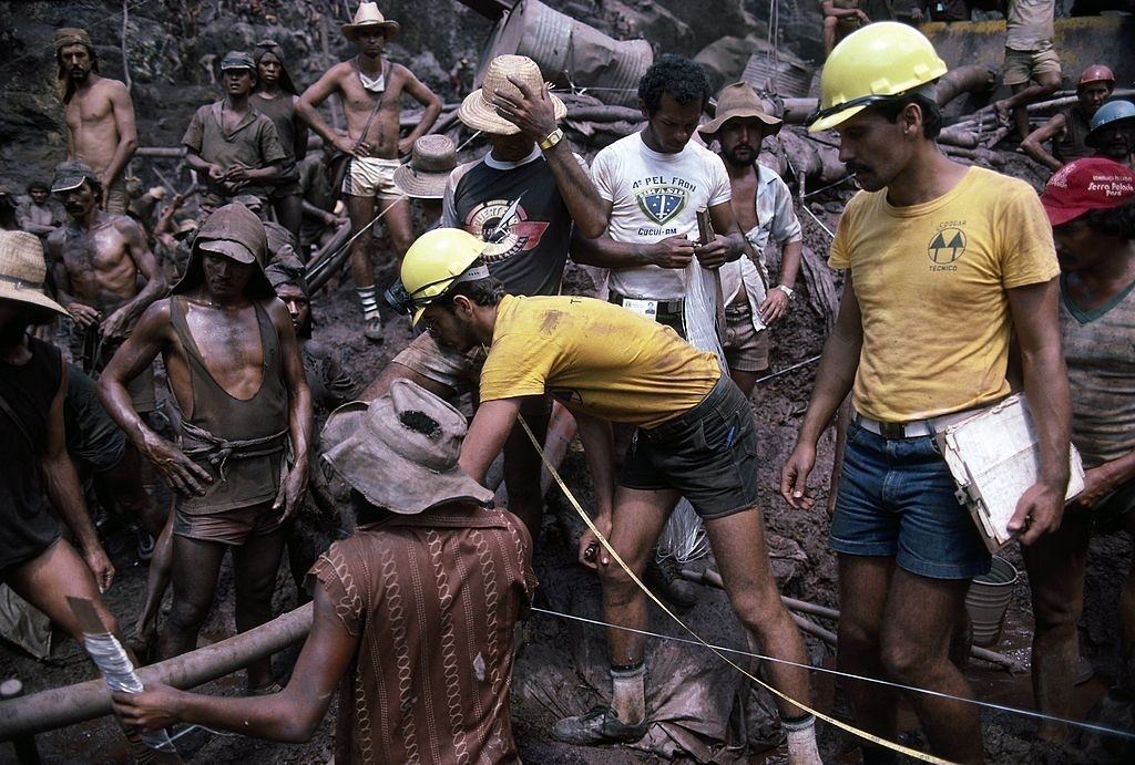 Mine surveyors in an open pit gold mine measure off a single plot.