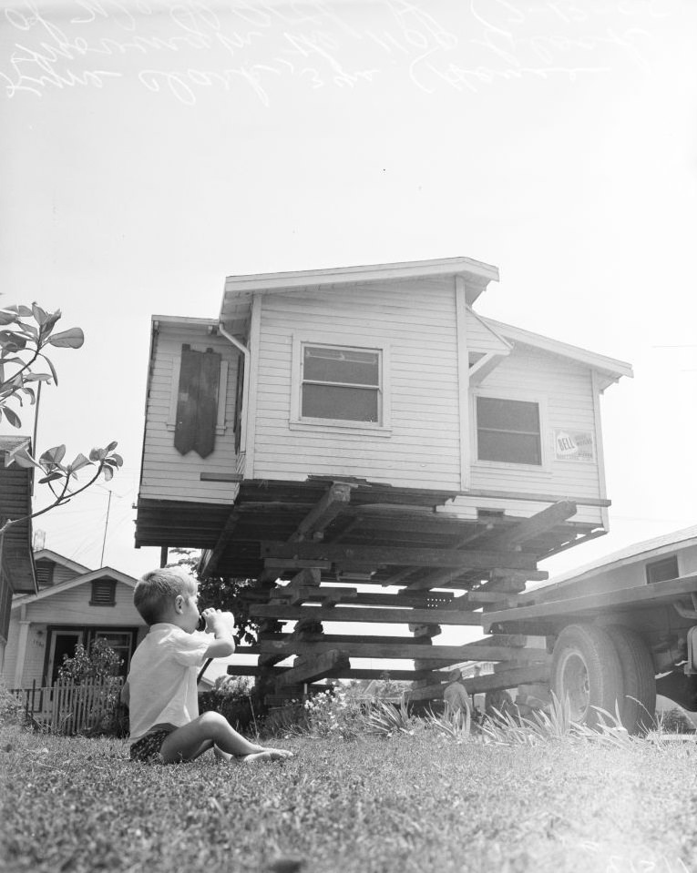 House moving in 1100 block of West 96th Street, Los Angeles, 13 July 1955.