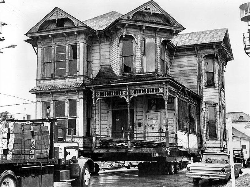 One of two Victorian houses, both designated as Los Angeles historical-cultural monuments, is shown being moved from Court Street, just west of downtown, to 1300 Carroll Ave., seven blocks away. March 1978