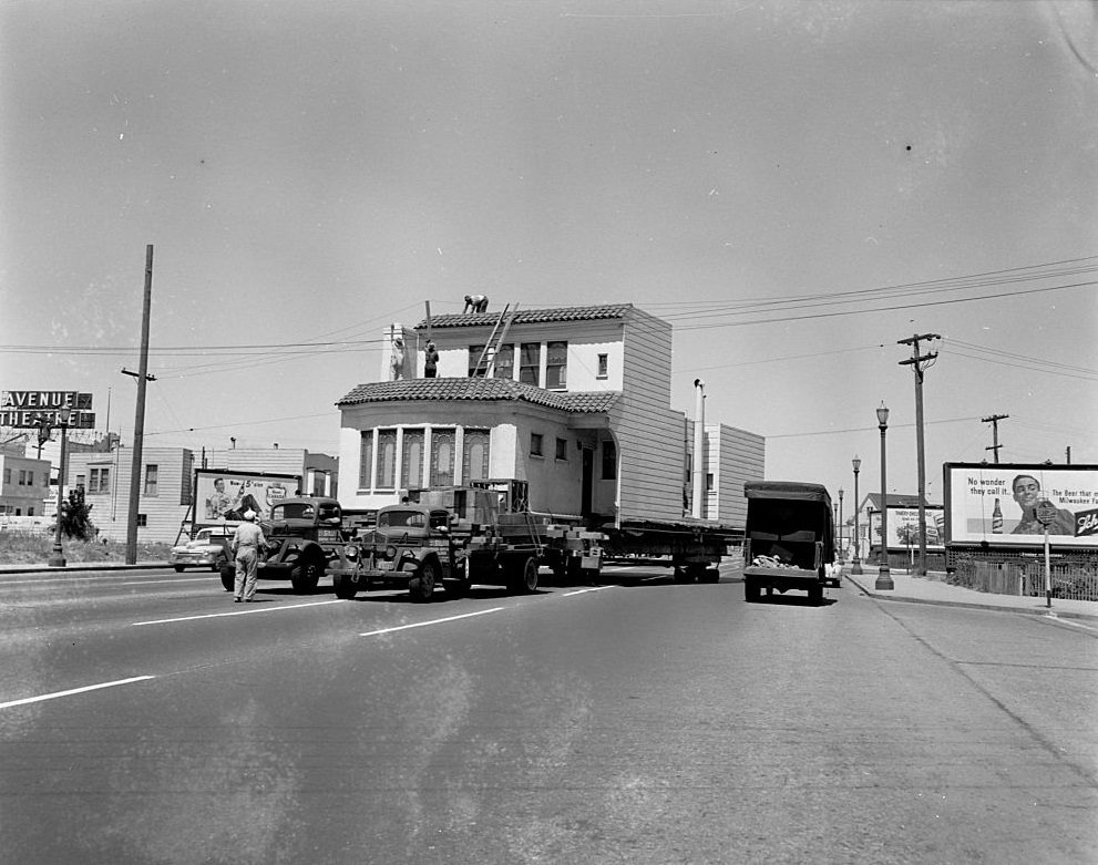 House being moved on Route 101, by a House moving truck in Los Angeles, 1948.