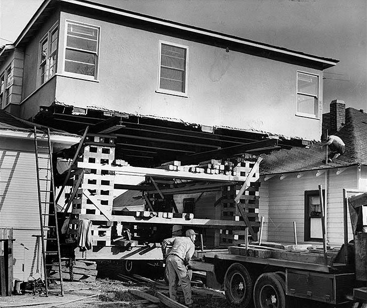 A house is raised 25 feet to move into its new location on West 43rd Street. The structure was moved from 94th Street and El Manor Avenue. Jan. 8, 1959