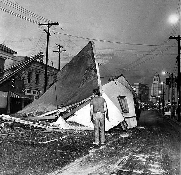 At about 5 a.m., a garage being moved from La Cañada to Hollywood slipped off its truck on Broadway near Alpine. Wreckers had to rip the structure apart to remove it before morning rush hour. July 10, 1968