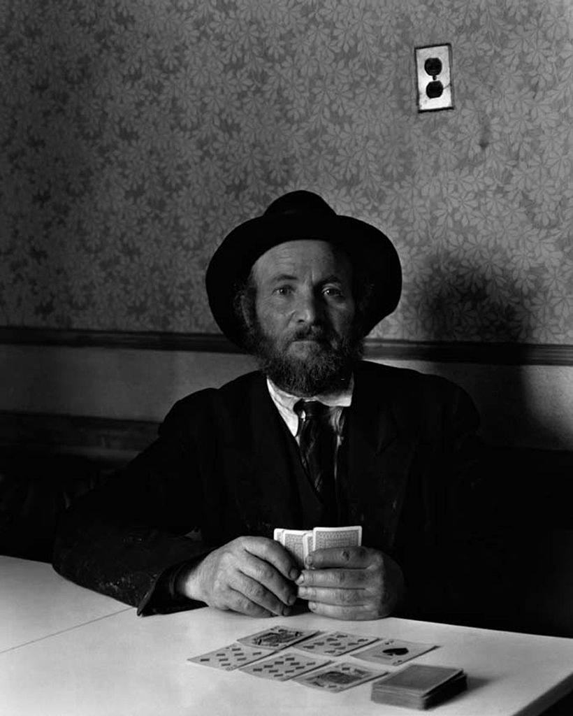 A man playing cards in New York's East Side, 1938.