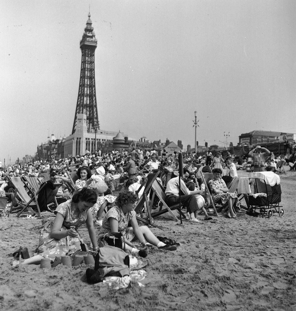 Holidaymakers on the beach at Blackpool during Wakes Week, the annual holiday for workers in the industrial north, July 1955.