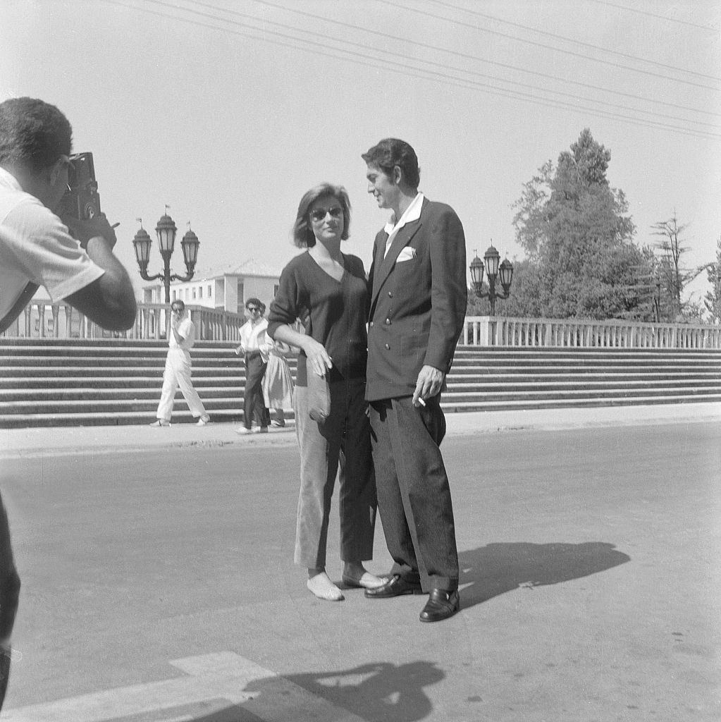 Anouk Aimée posing with a man during the XVI Venice International Film Festival, 1950