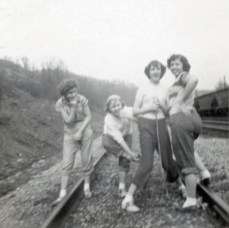 Teen girls on railroad tracks