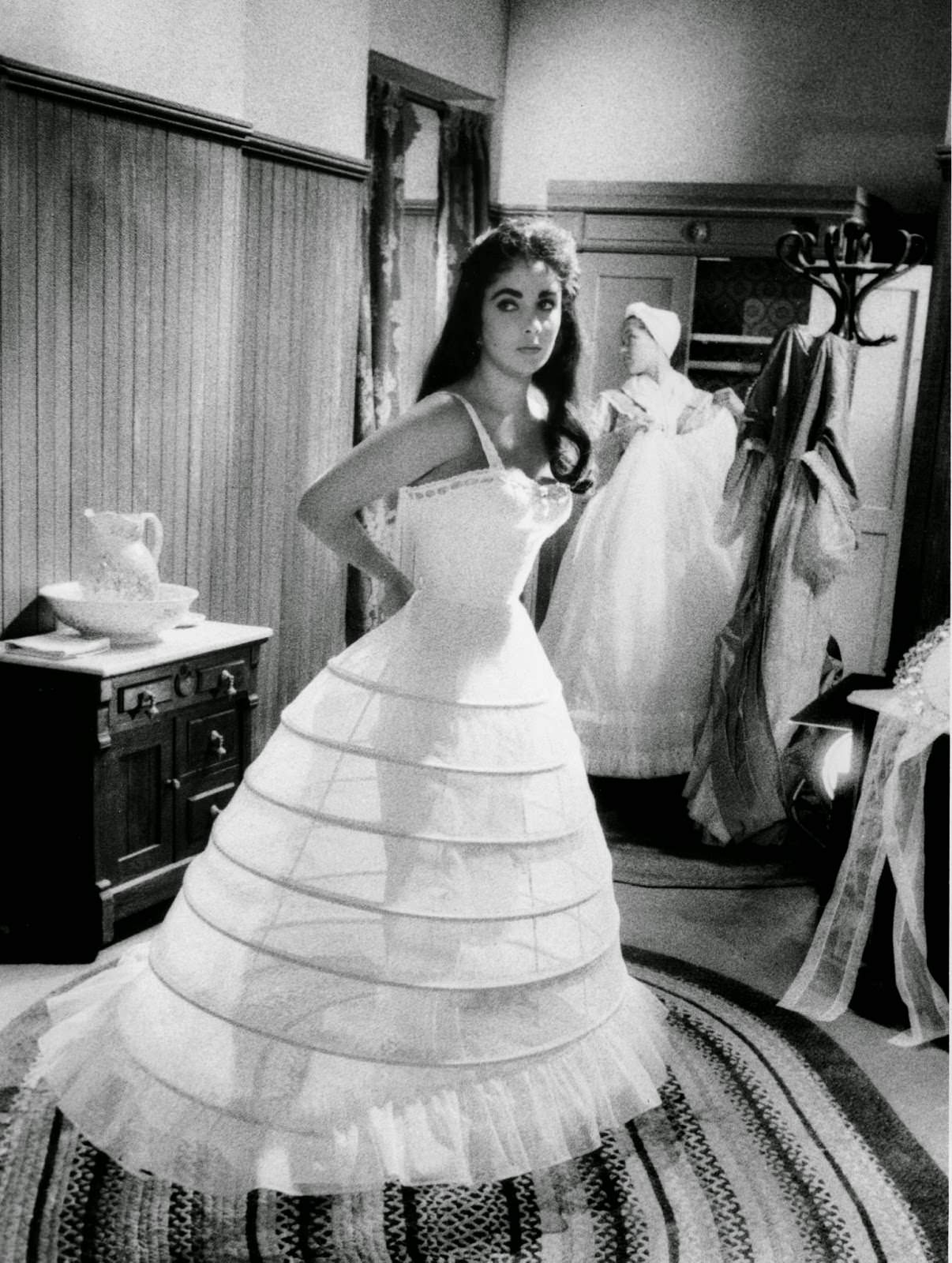 Elizabeth Taylor dresses for a scene on MGM's "Raintree County," 1956