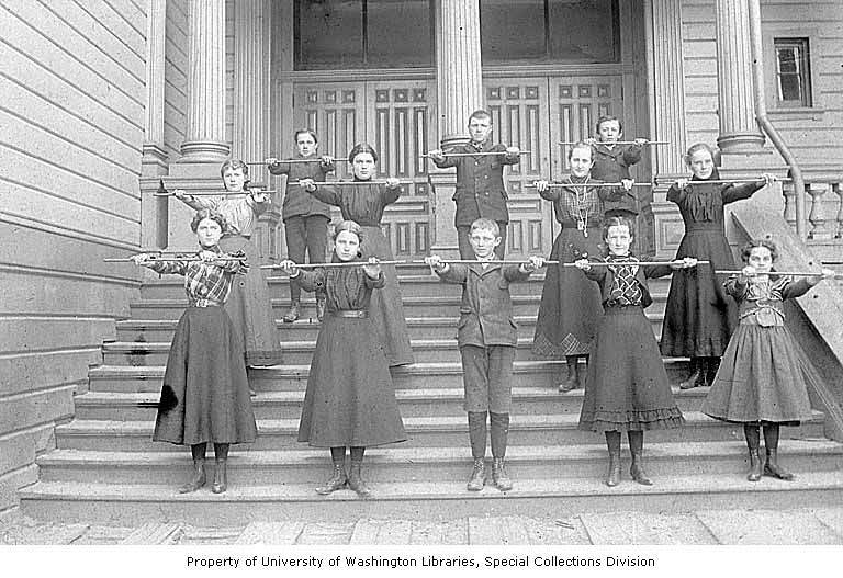 Eighth grade class standing on steps of the Denny School, Seattle, 1899