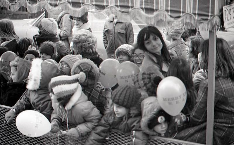 People riding in trolley in North End Christmas Parade