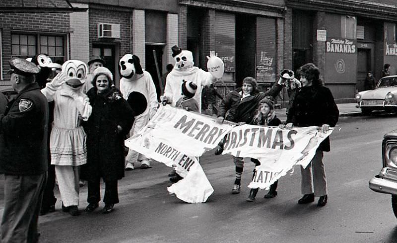 Characters in costume and others march in North End Christmas Parade