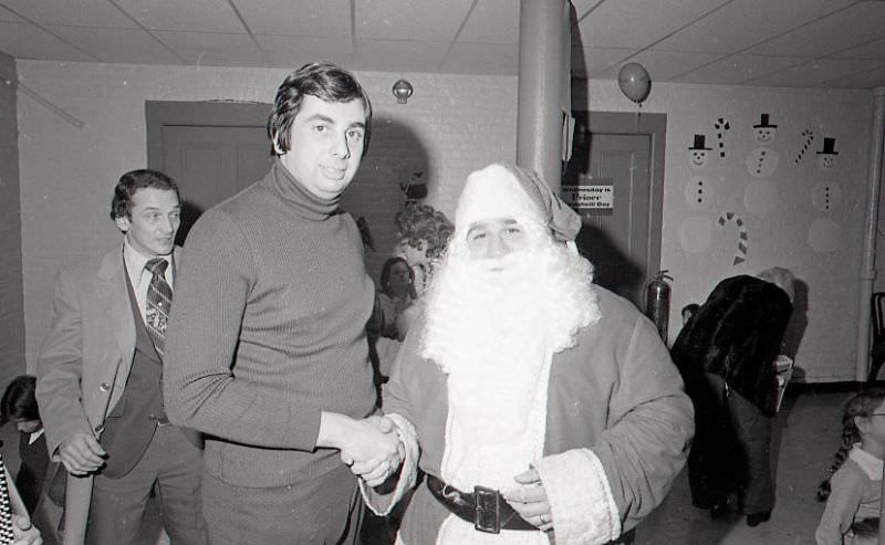 Man with Santa Claus at North End Christmas Party