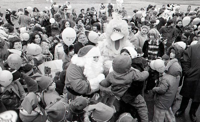 Santa Claus with crowd and Big Bird at North End Christmas Party and Parade