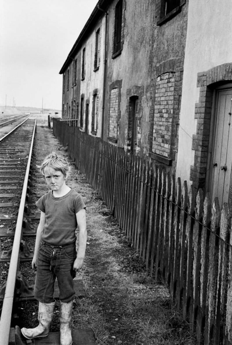 A boy on a disused railway track in Dowlais