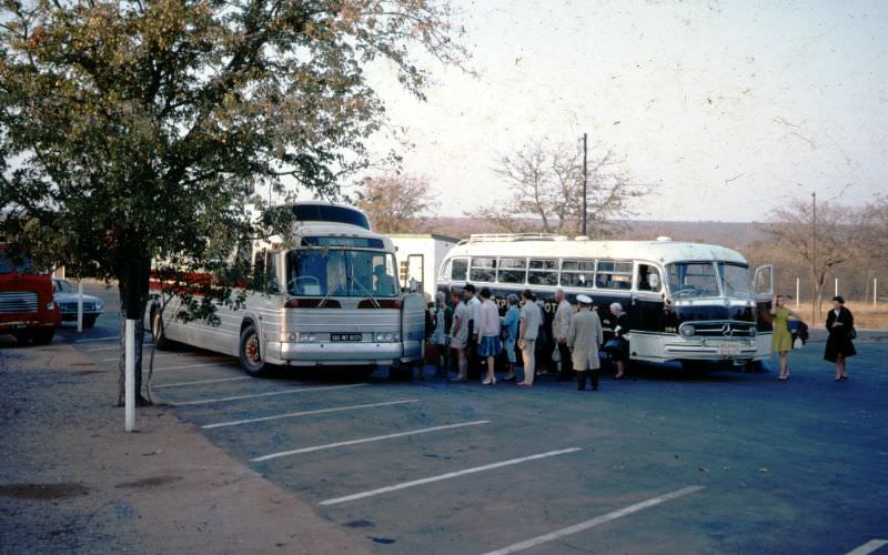 Passengers change from and Express Motorways Coach at Beitbridge to South African Railways Coach on way to Pretoria, September 29, 1968