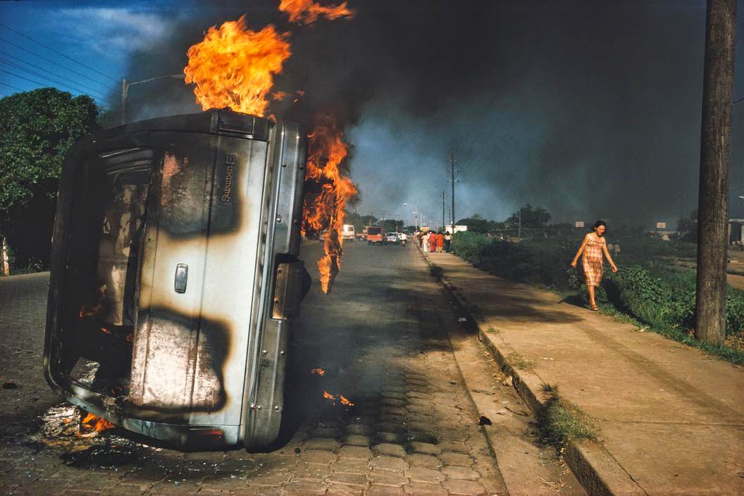 Car of a Somoza informer burning in Managua, Managua, 1970s