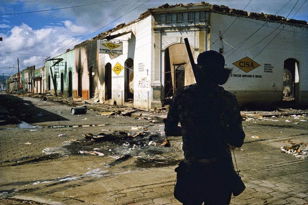 Muchacho withdrawing from commercial district of Masaya after three days of bombing, Masaya, 1970s