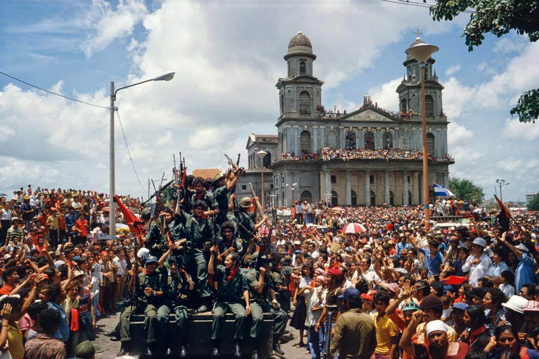 Entering the central plaza in Managua to celebrate victory, Managua, 1979