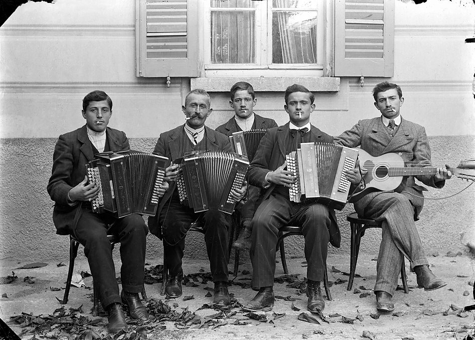 Group of musicians in front of a building, Bleniotal