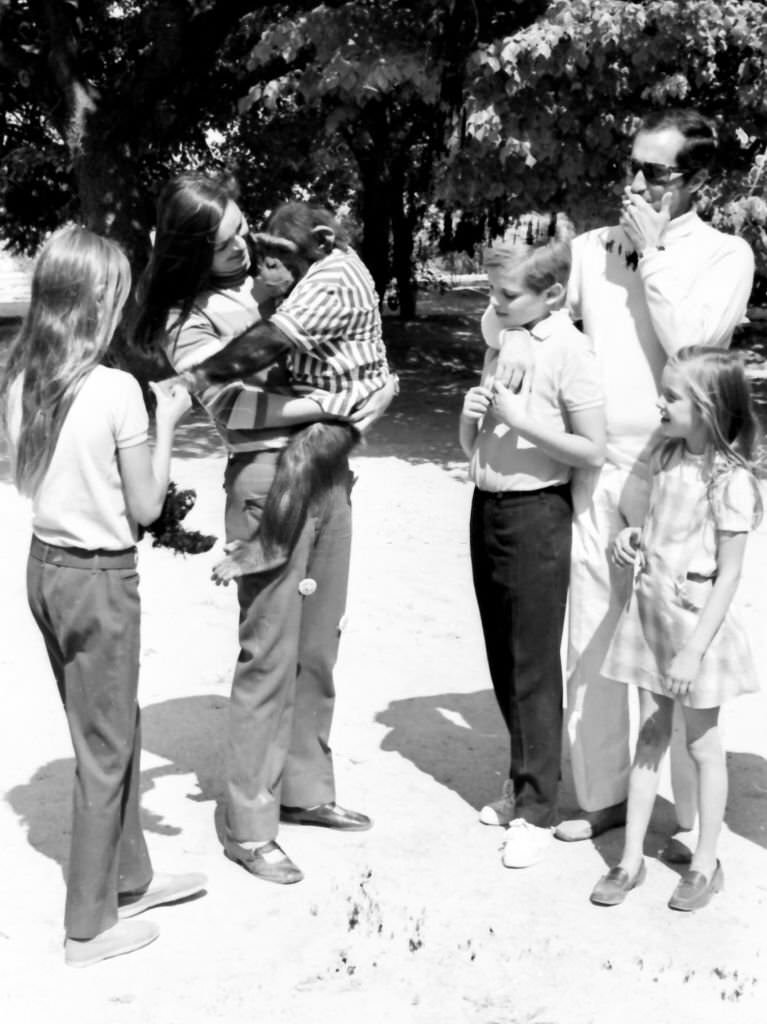 Spanish bullfighter Luis Miguel Dominguin and his wife the Italian actress Lucia Bose play with a monkey together with their children Miguel, Lucia a Paola at their Villa Paz farm, Saelices, Cuenca, 1967.