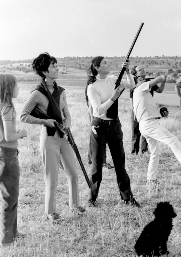 Lucia Bose practices skeet shooting at her farm in Villa Paz, Saelices, Cuenca, Spain, 1967.