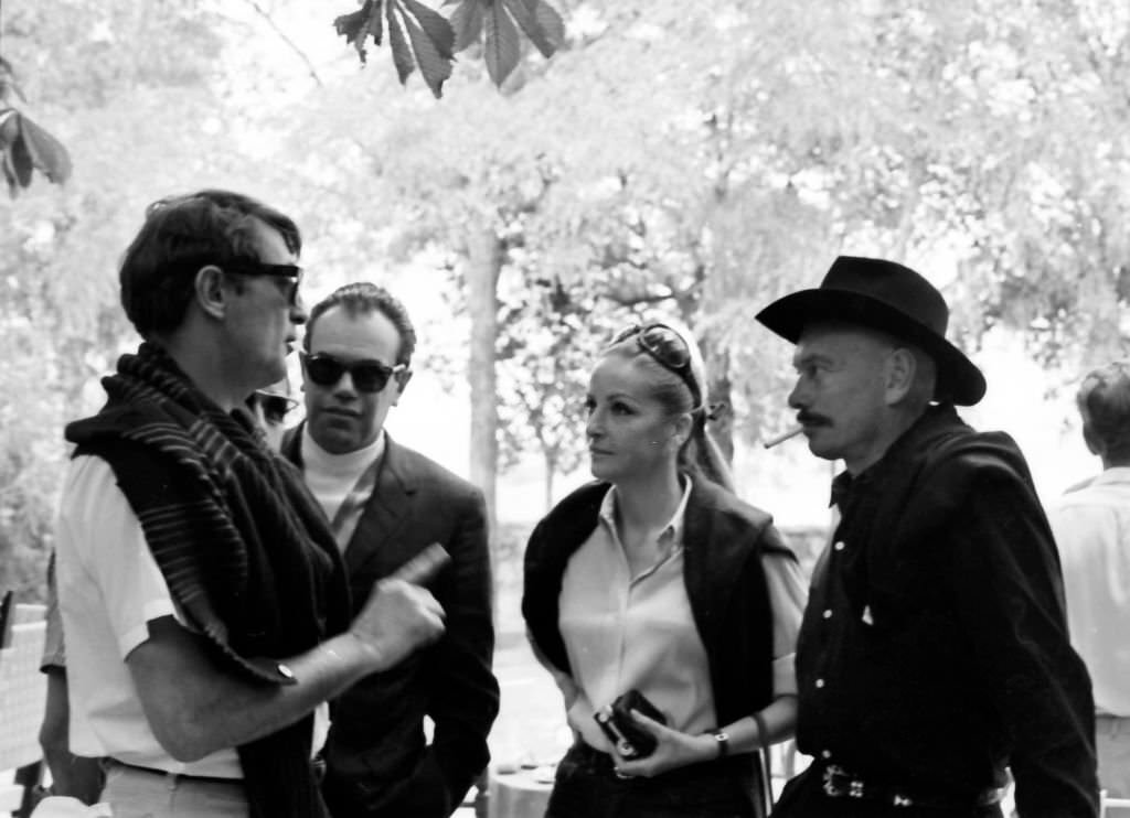 American actors Robert Mitchum with Yul Brynner and his wife Doris Kleiner at the "Villa Paz" farm of the bullfighter Luis Miguel Dominguin Saelices, Cuenca, Spain, 1967.