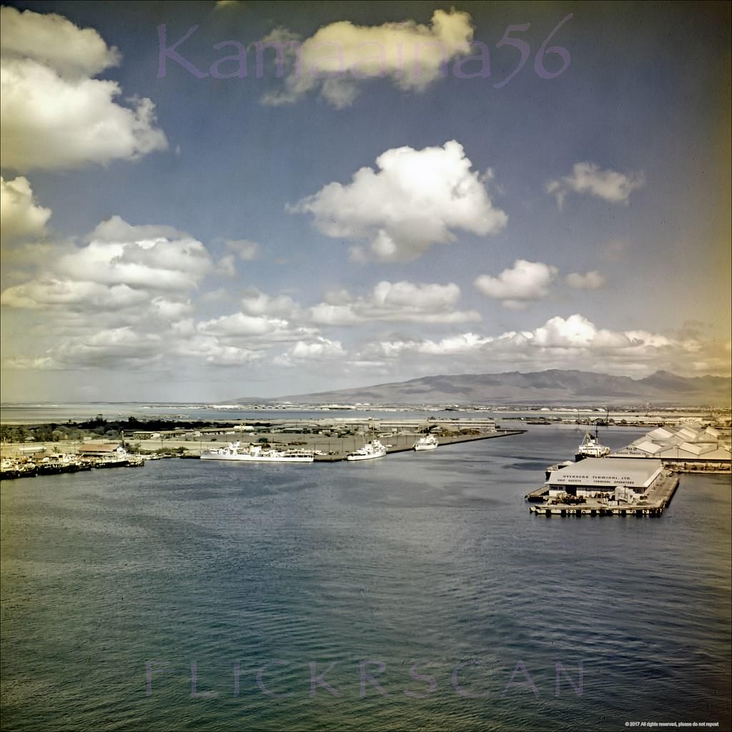 Birdseye view of Honolulu Harbor and Sand Island looking west from the observation deck of the 10-story 1926 Aloha Tower, 1950s