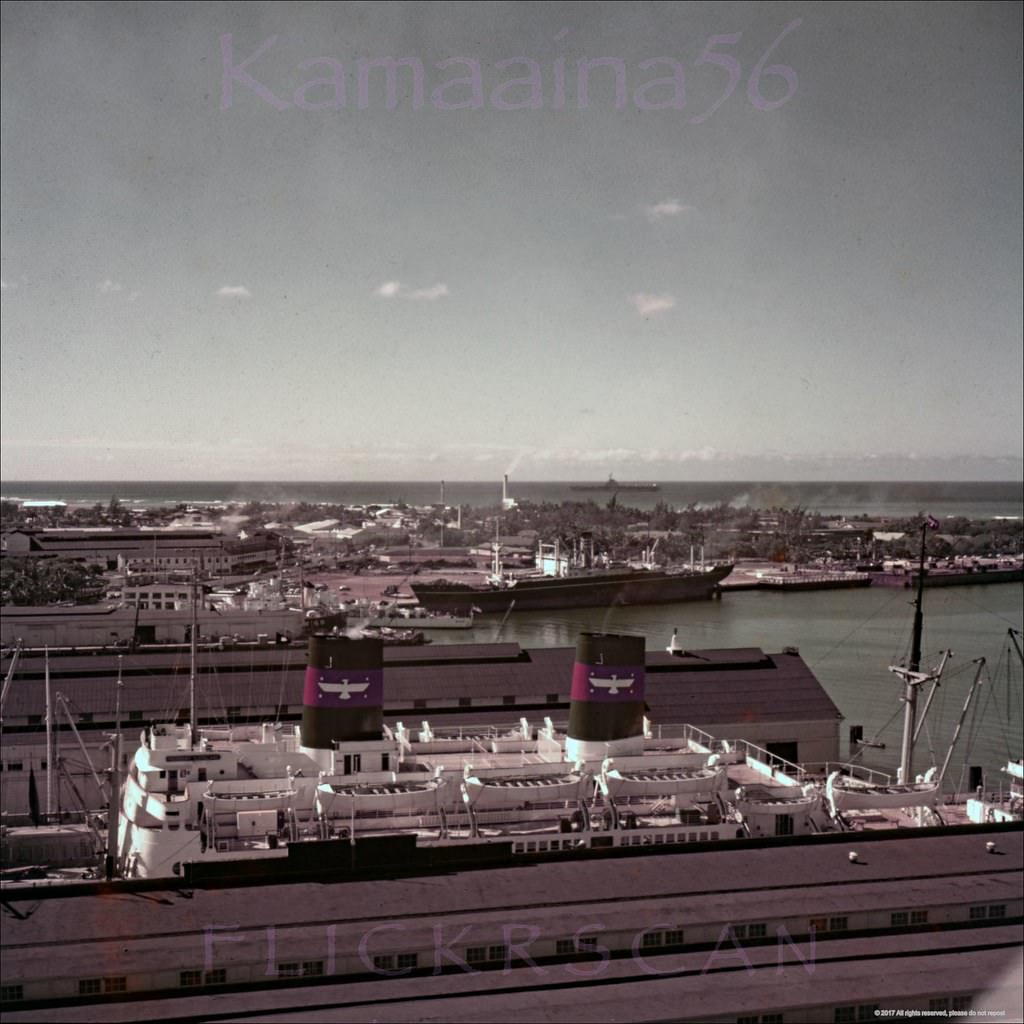 Interesting birdseye view from the top of the Aloha Tower looking across Honolulu Harbor towards Fort Armstrong and the Kakaako section of Honolulu, 1950s