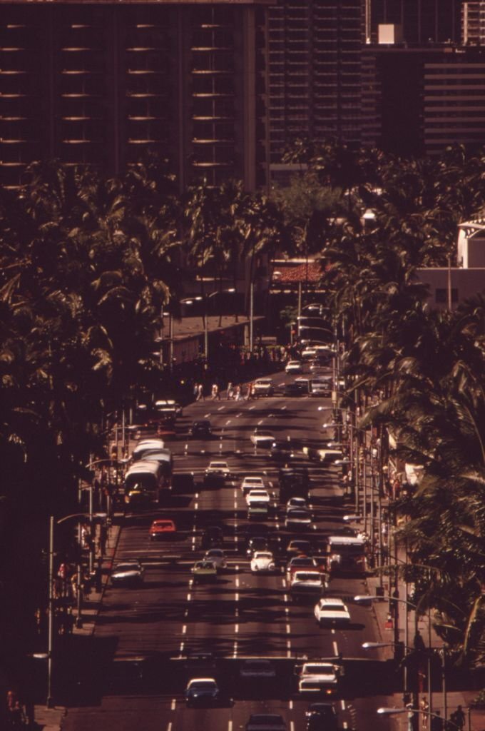 View of traffic down Kalakaua Avenue, the main street of the Waikiki Beach area, Honolulu, Hawaii, October, 1973.