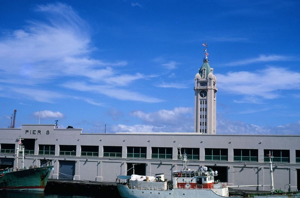 View of Pier 8 and the Aloha Tower, from a boat docked on the pier, Honolulu, Hawaii, 1970.