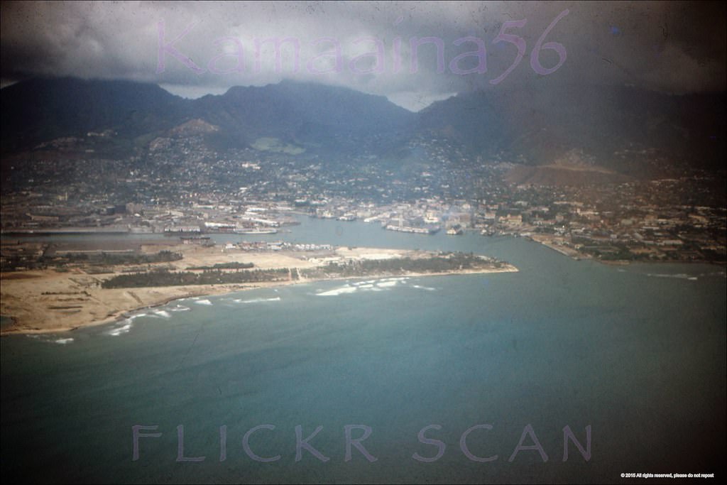 Airplane view of Honolulu Harbor with Sand Island in the foreground, 1952