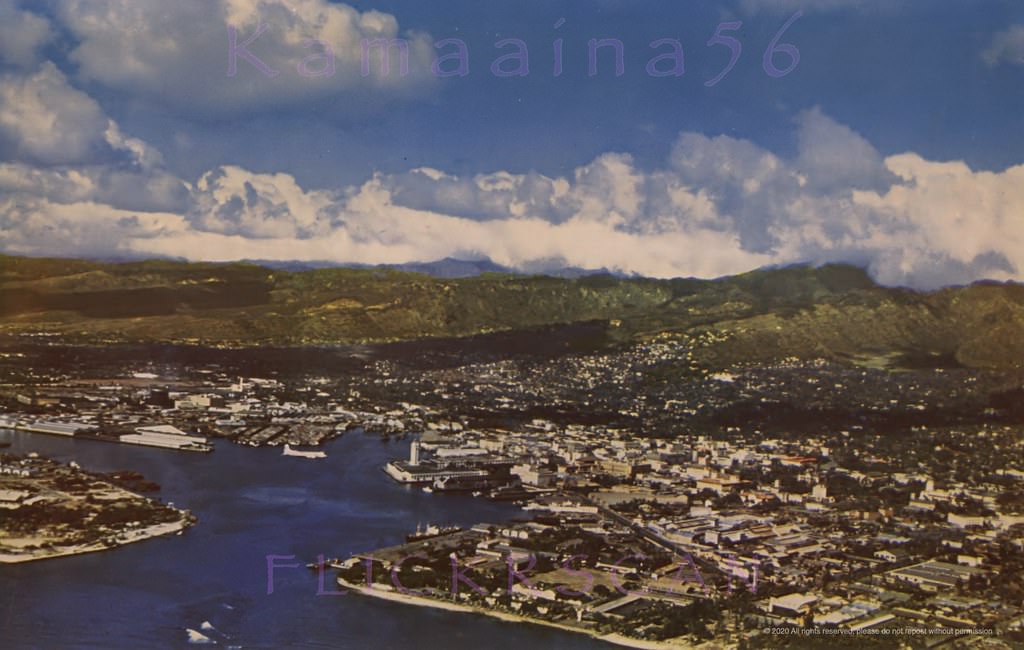 Aerial view of Honolulu Harbor looking mauka (inland) from above the Kakaako coastline, 1950s