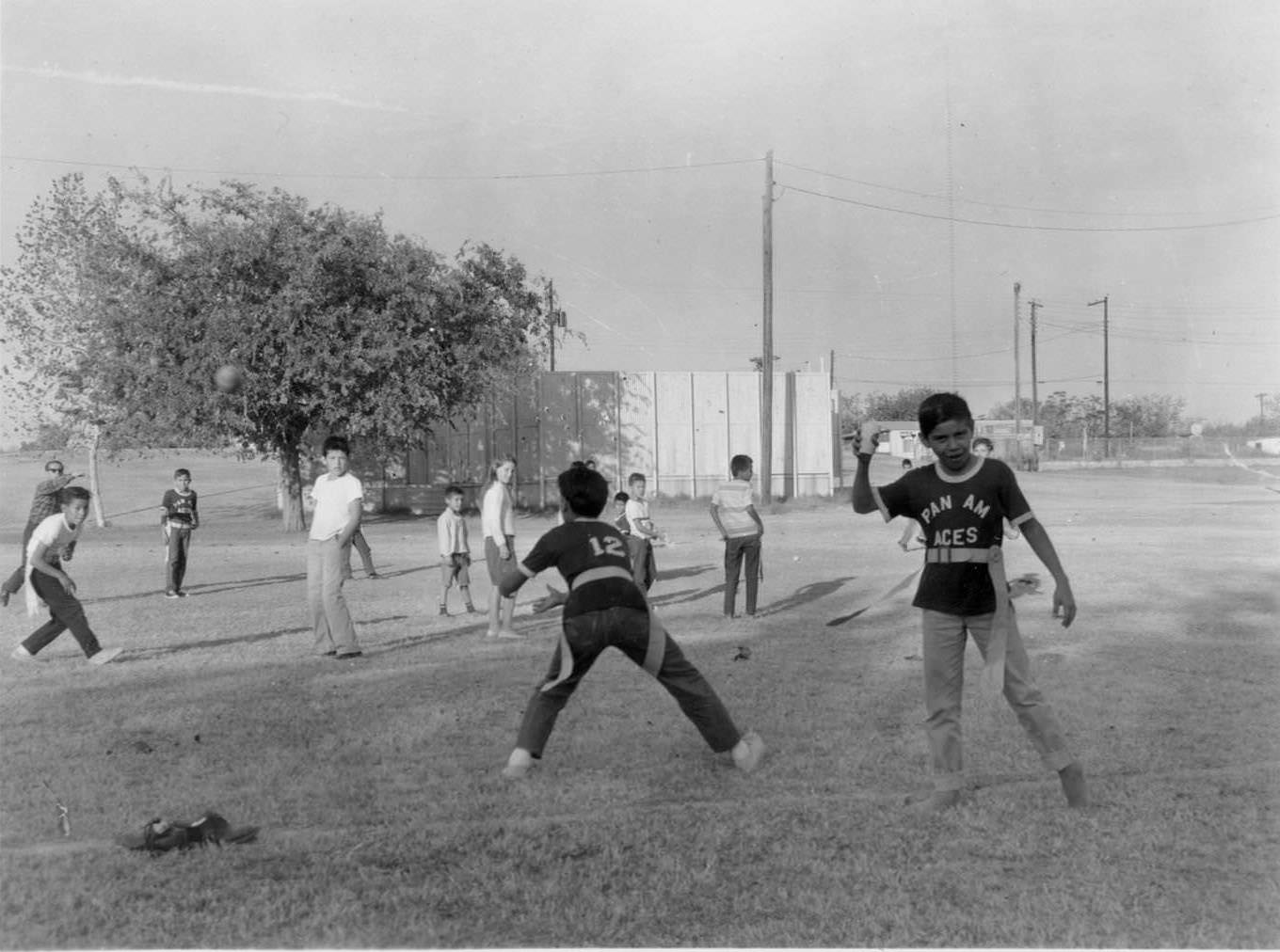 Children, aged about 10-13 play flag football at the Pan Am Recreation Center, 1966