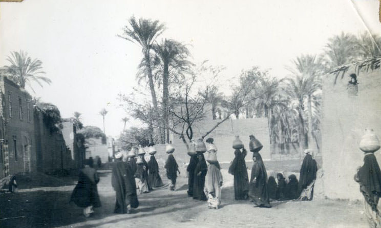 Egyptian women carrying water