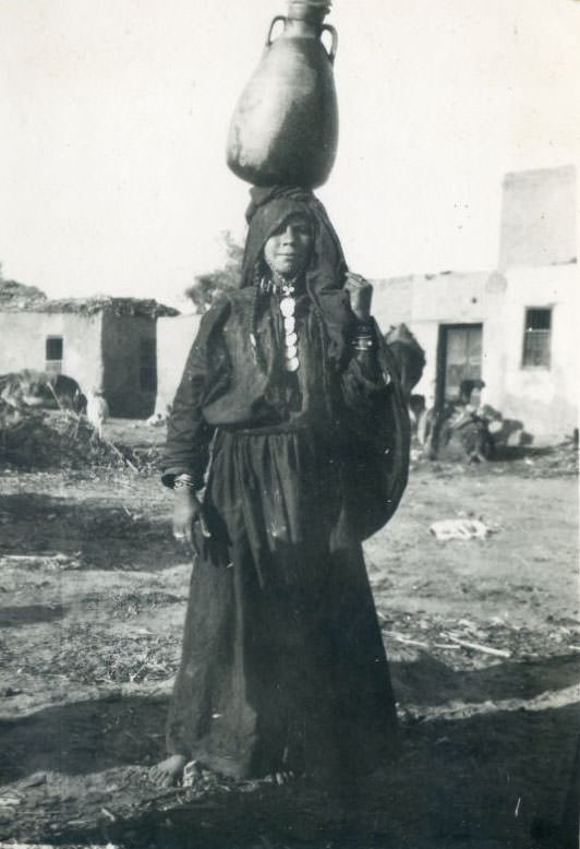 Native woman carrying water, Egypt