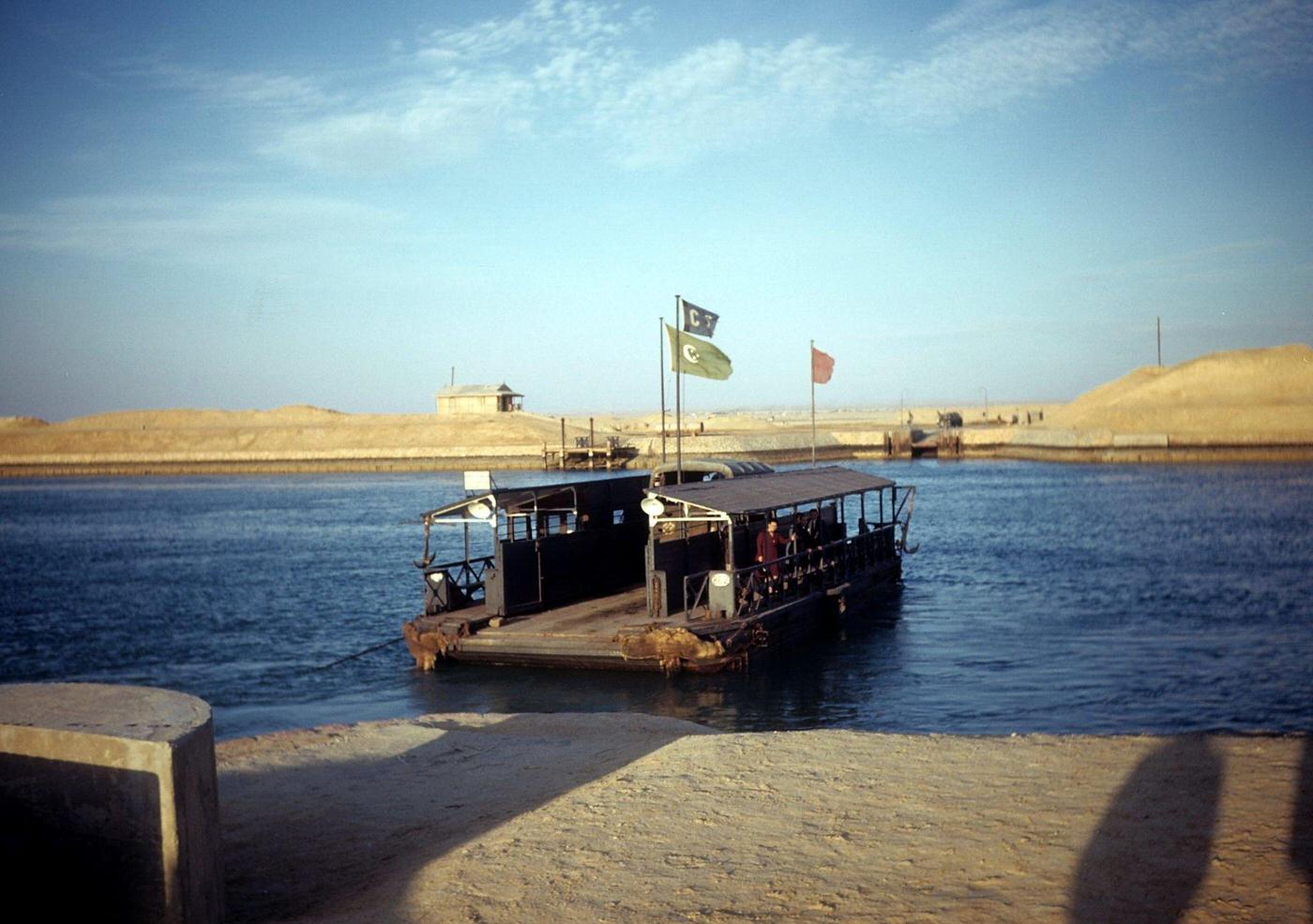 A view of a ferry boat crossing the Suez Canal in Egypt, 1948