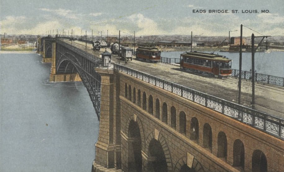 Streetcars cross the Eads Bridge, which spans the Mississippi River from St. Louis, 1900