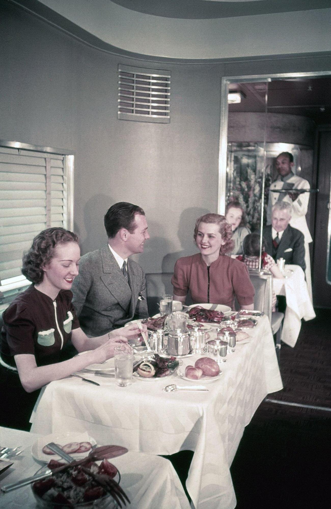 Passengers sitting at a table in the Pullman