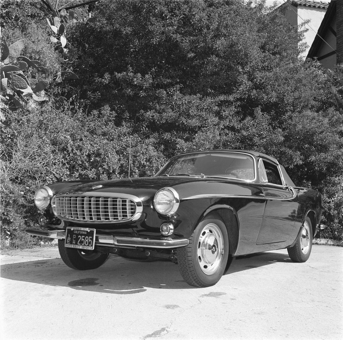 Volvo P1800 with a removable vinyl-covered hardtop over the front seats and a convertible top over the rear seat, 1965