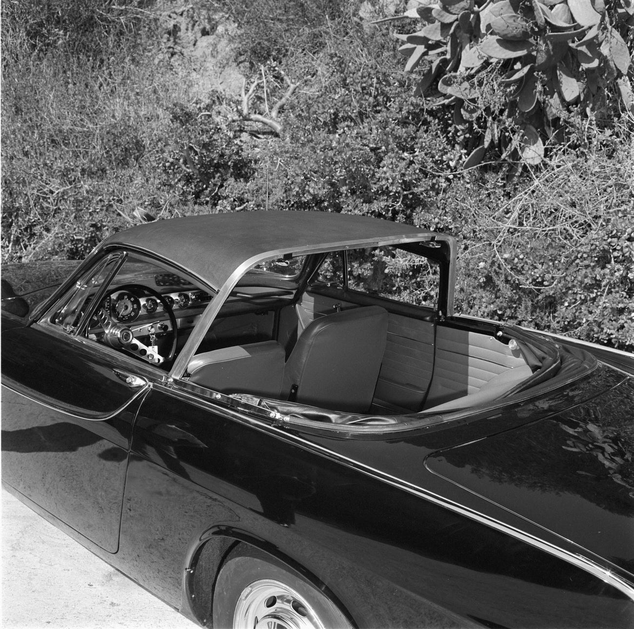 Volvo P1800 with a removable vinyl-covered hardtop over the front seats and a convertible top over the rear seat, 1965