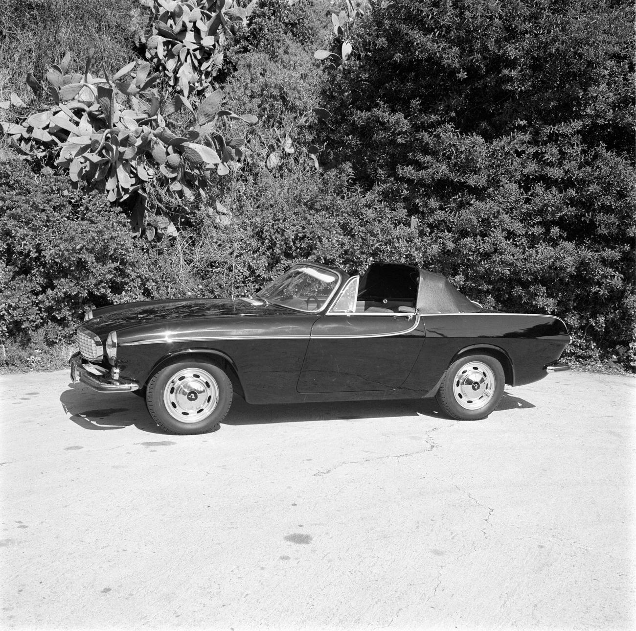 Volvo P1800 with a removable vinyl-covered hardtop over the front seats and a convertible top over the rear seat, 1965