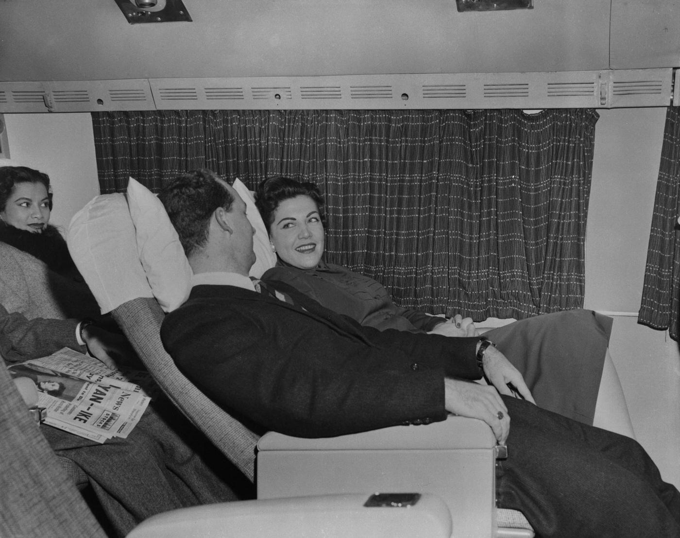 Passengers prepare to take a nap on a Transocean Air lines Boeing 377 Stratocruiser in the mid-1950s. Transocean Air lines was a pioneer discount airline that flew between 1946 and 1962.