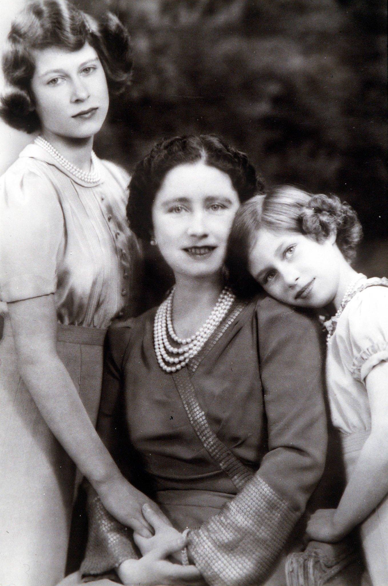 Queen Elizabeth (later The Queen Mother) with her two daughters, Princess Margaret (right) and Princess Elizabeth who later became Queen Elizabeth II in 1940.