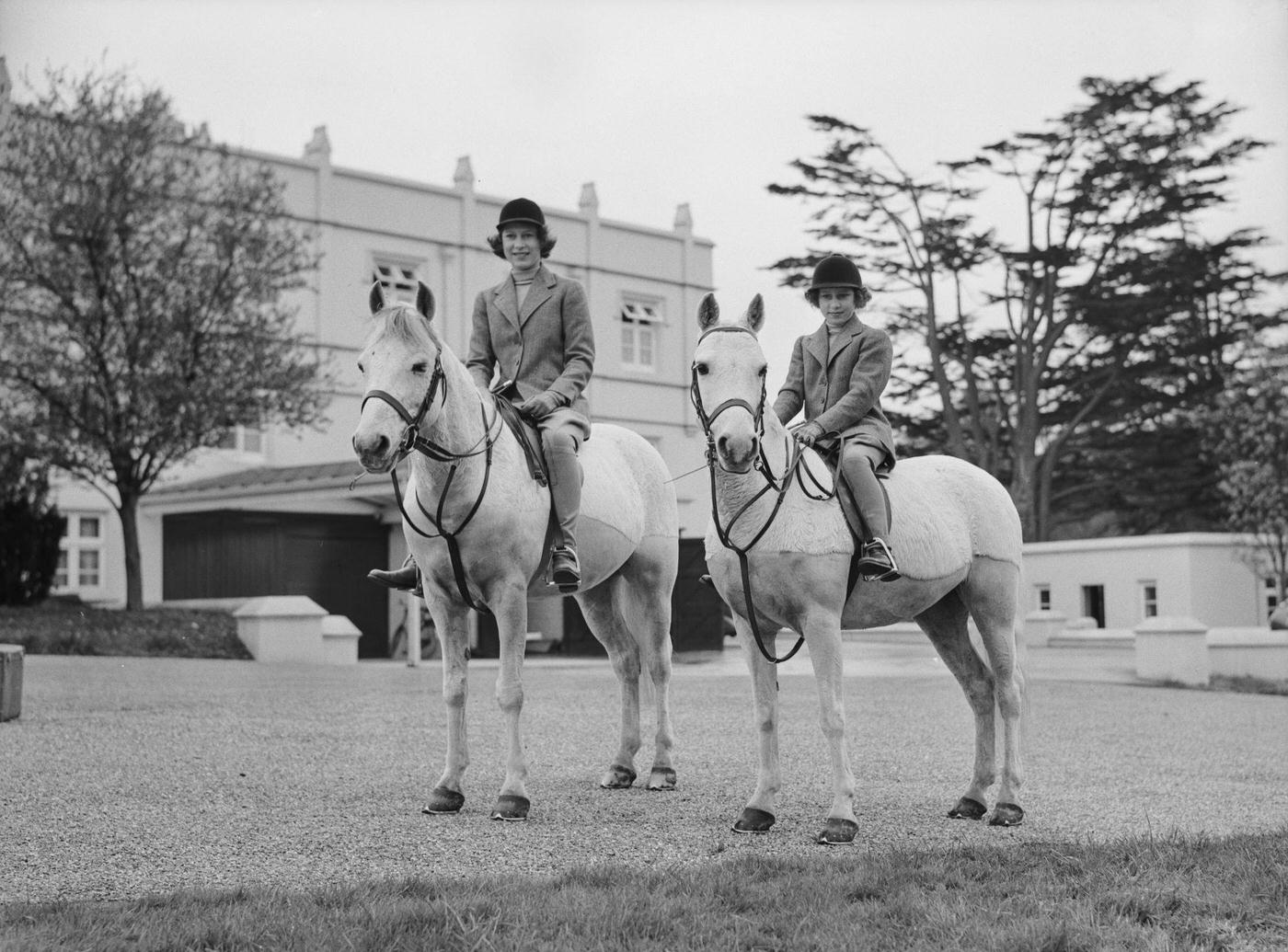 The Royal Princesses Elizabeth and Margaret riding horses, UK, 1940.